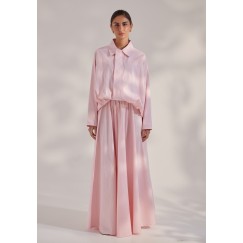 A long-Sleeve Bomber Jacket Paired With A Flowy Skirt