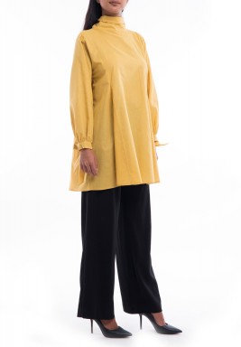 توب أصفر فضفاض بفيونكات